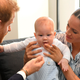 Prince Harry, Duke of Sussex and Meghan, Duchess of Sussex tend to their baby son Archie Mountbatten-Windsor at a meeting with Archbishop Desmond Tutu at the Desmond & Leah Tutu Legacy Foundation on September 25, 2019 in Cape Town, South Africa.